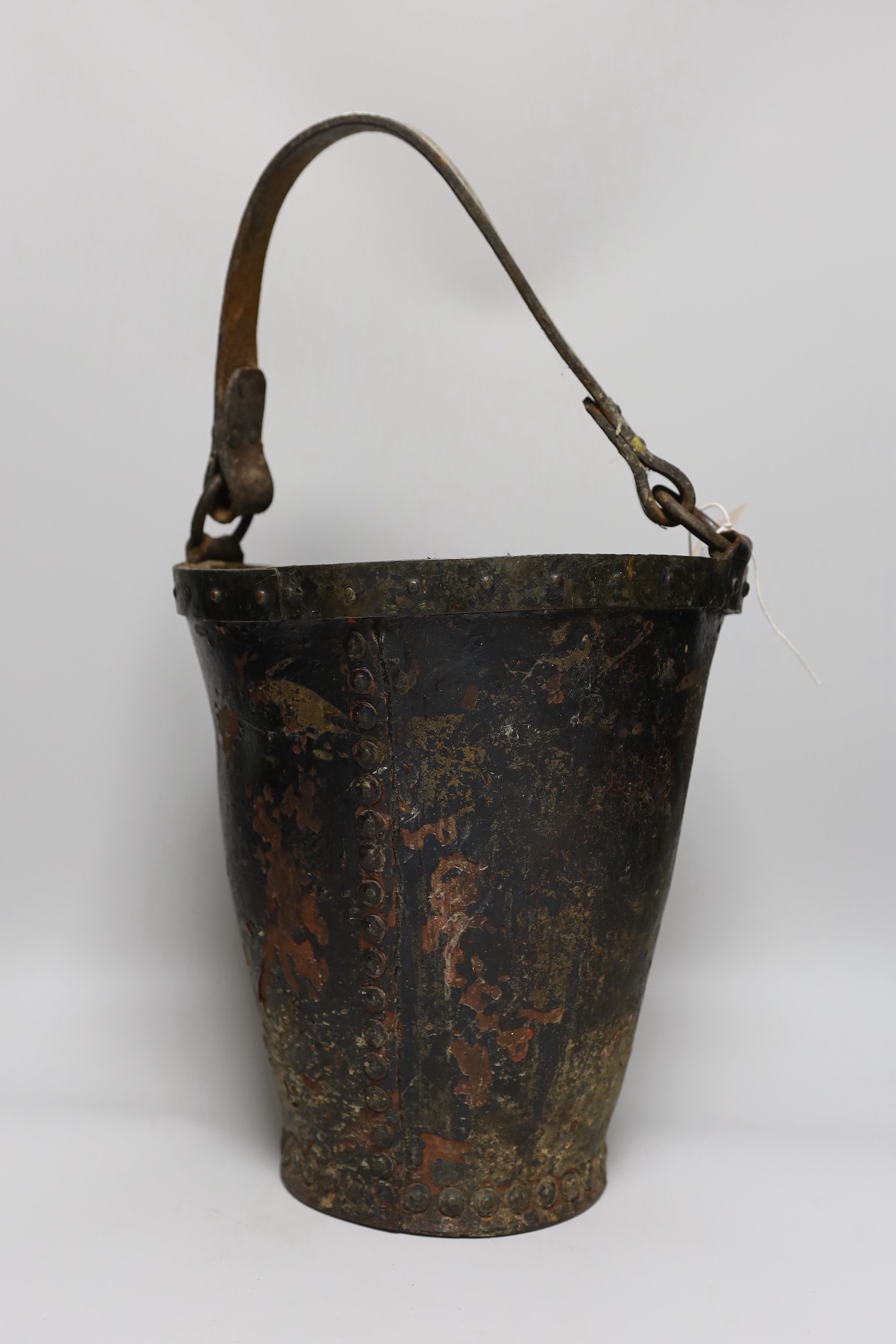 A Victorian leather bound coat of arms fire bucket, bucket 30cms high (not including handle)